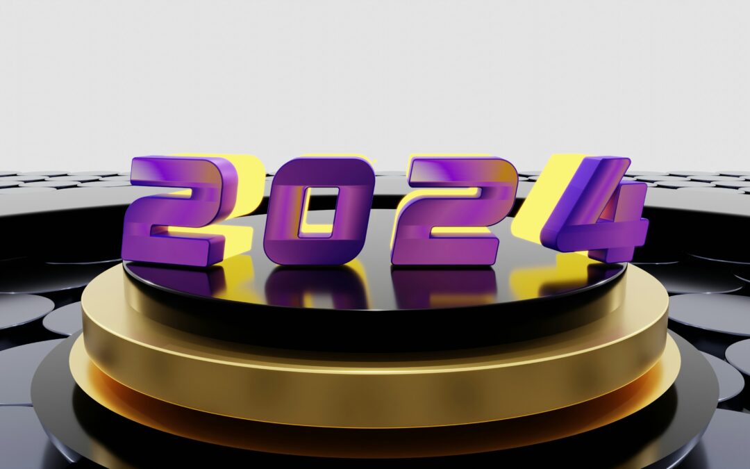 2024 in three dimensional neon figures. The numbers are in purple and yellow, and are sitting 0n a round black dias, which in turn is sitting on a larger round gold dias.